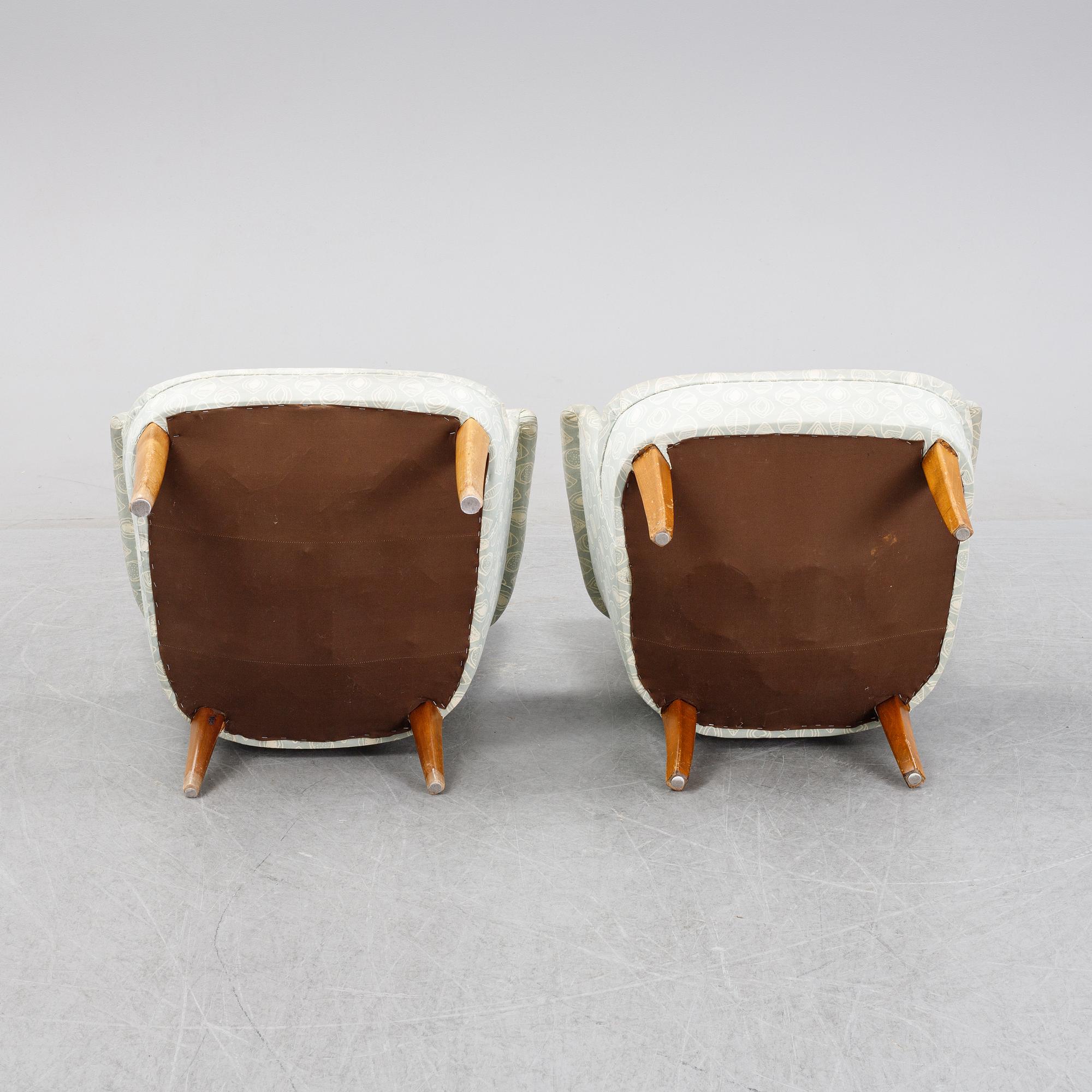 A pair of easy chairs by Carl Malmsten second half of the 20th Century.