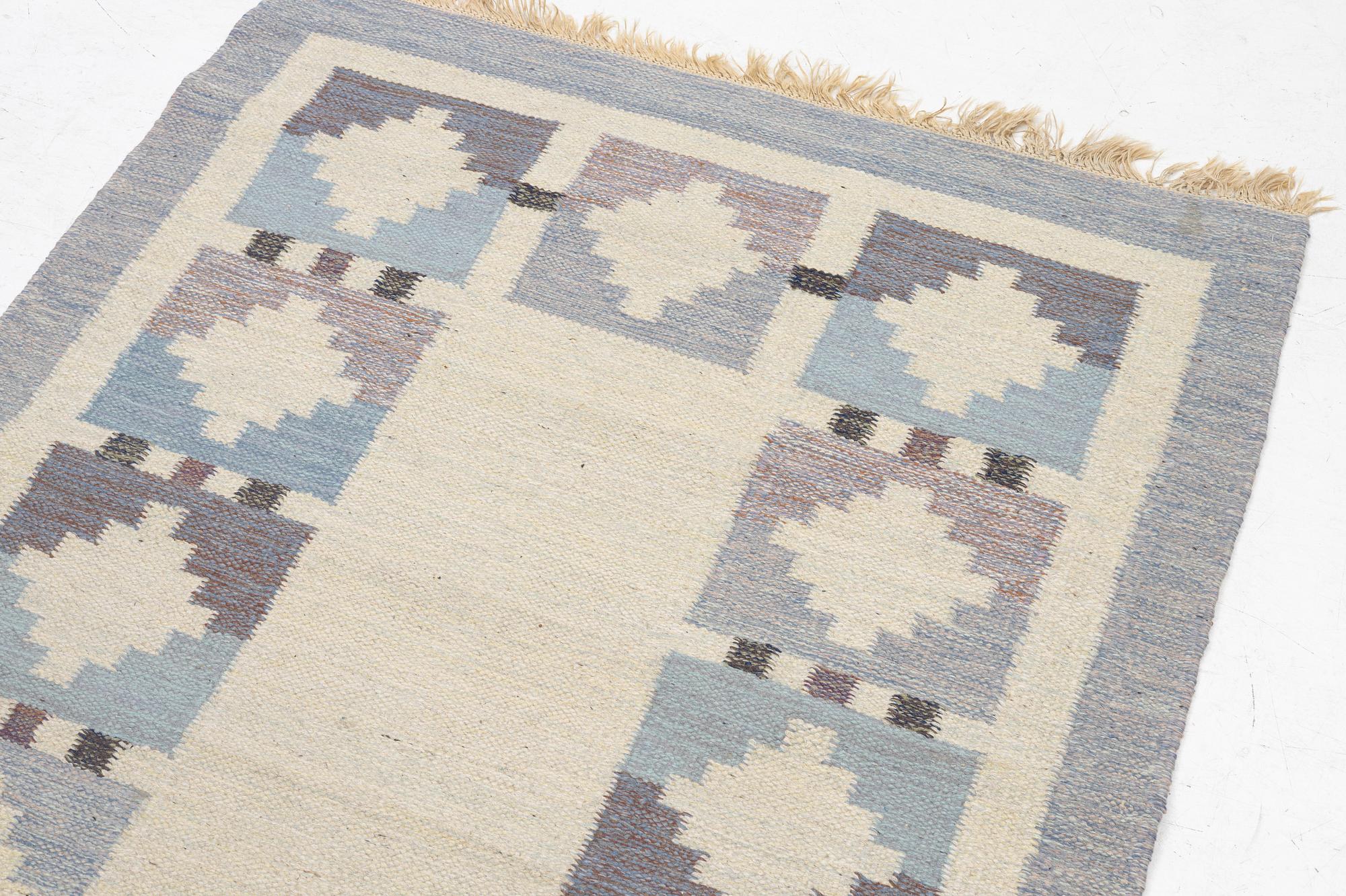 A flat weave rug, signed JK, approx. 195 x 137 cm.