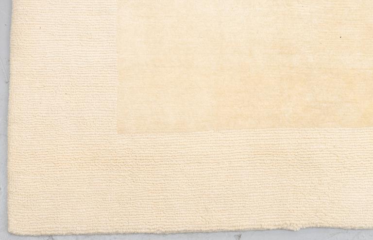 A carpet, knotted and loomed, ca 328 x 347 cm.