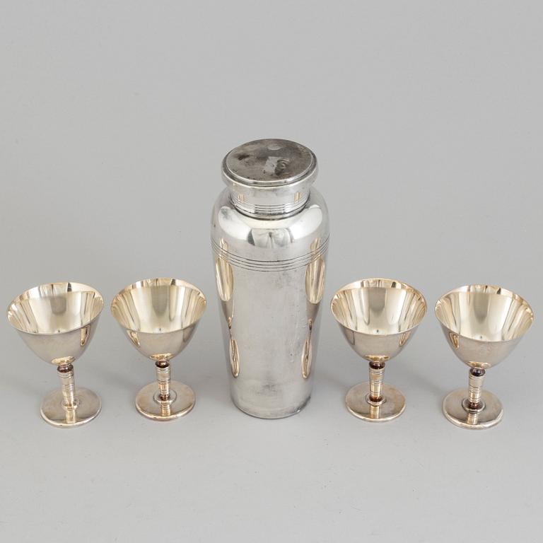 A mid 20th century silver plated shaker and four glasses.