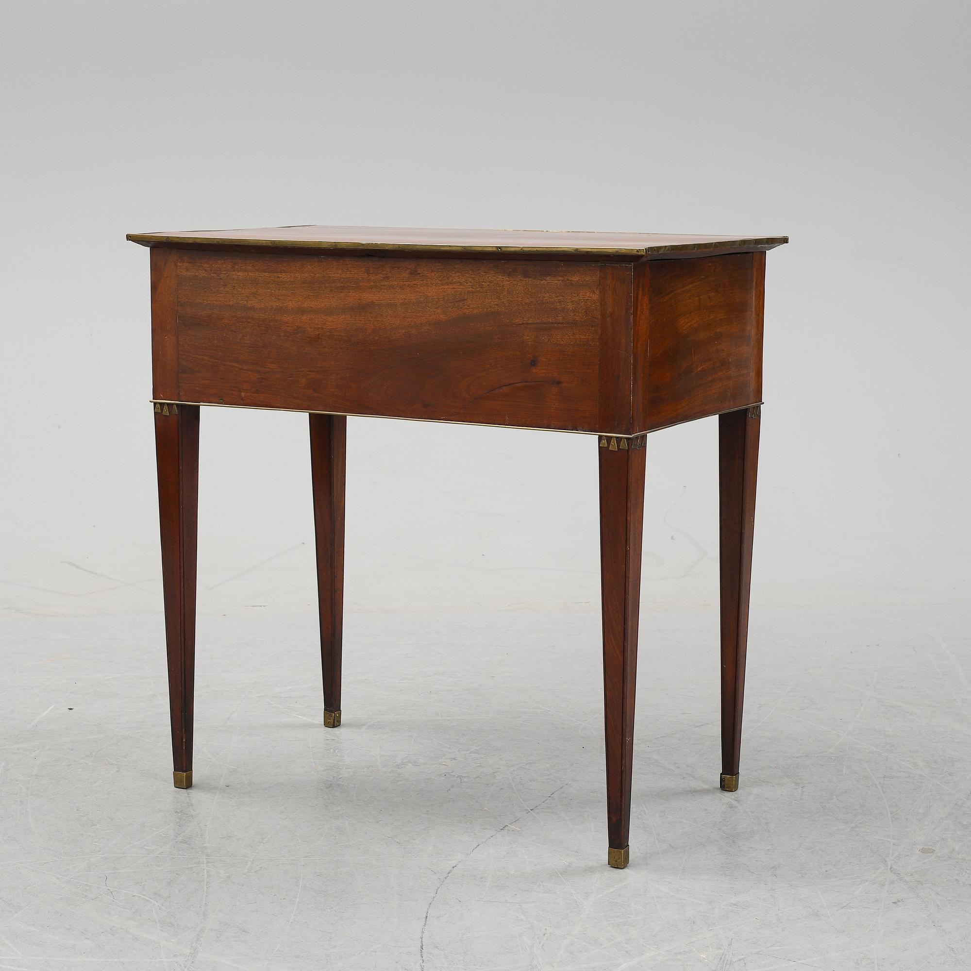 A late Gustavian mahogany tabld with drawers, end of the 18th Century.