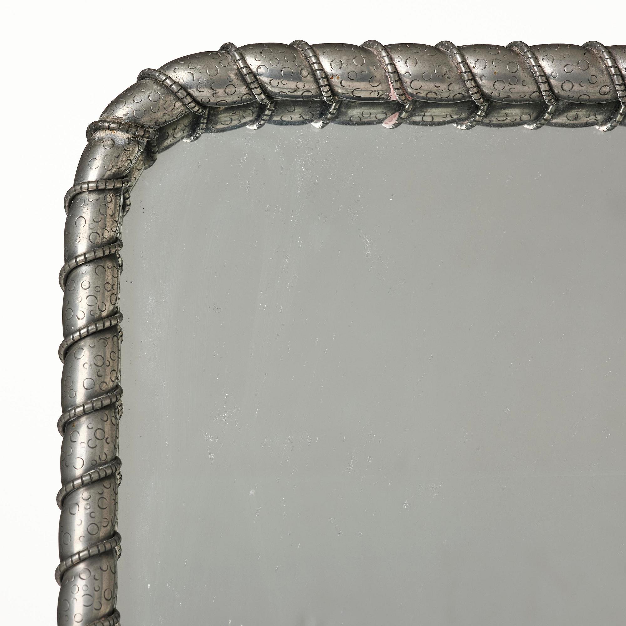 Estrid Ericson, a pewter framed mirror model "A 2518", Firma Svenskt Tenn, Stockholm, 1947.