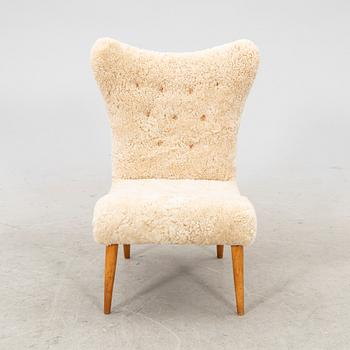 A Swedish Modern 1940s sheep skin armchair.