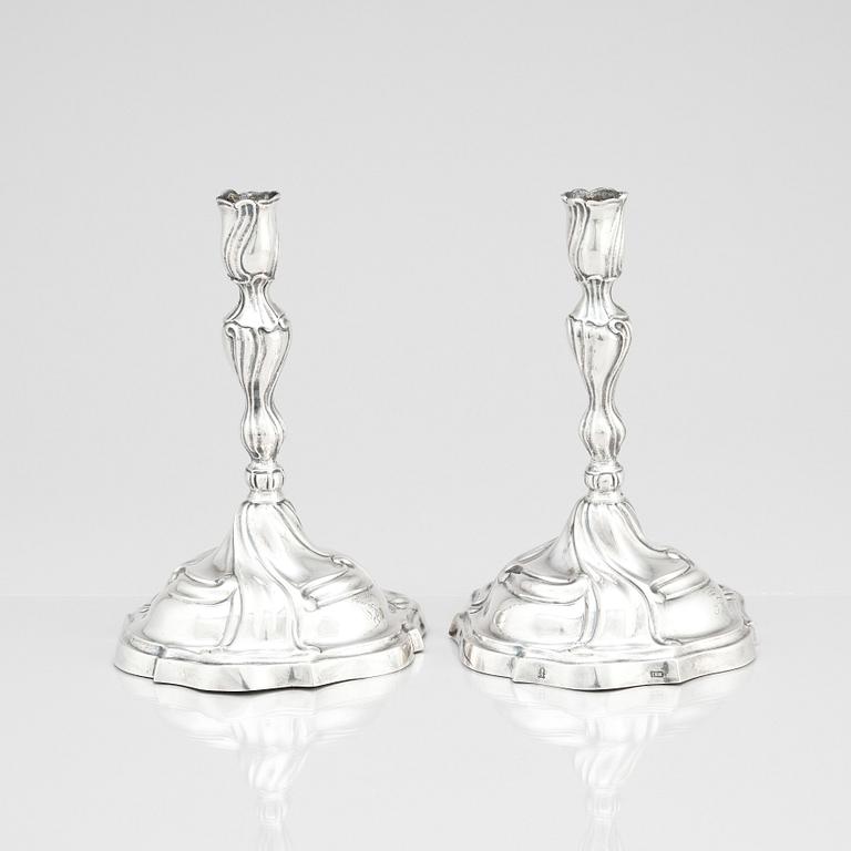 A pair of German silver rococo candle sticks, marks of Johann Balthasar Heckenauer, Augsburg (1775-1777).