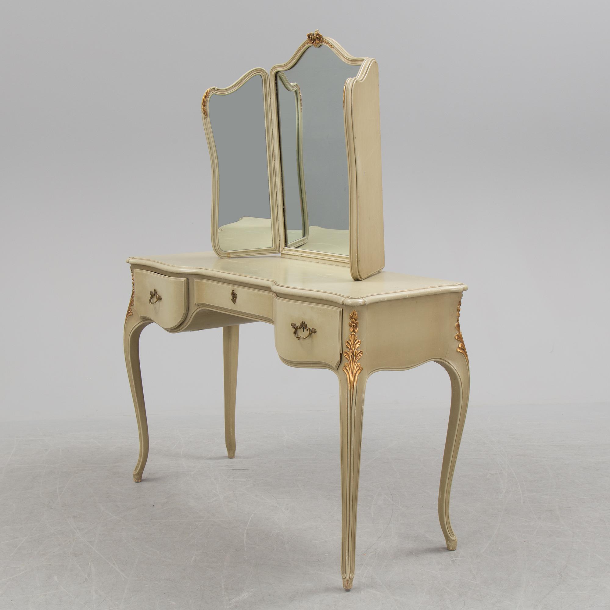 A mid 20th century Rococo style dressing table, a pair of bedside tables and one stool.