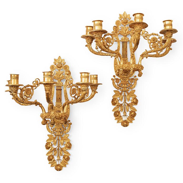 A pair of French 19th century gilt bronze five-light wall-lights.