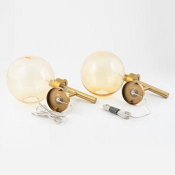 Uno & Östen Kristiansson, a pair of brass and glass wall lights, Luxus, Vittsjö.