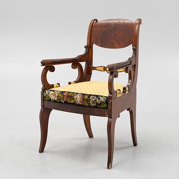 A Russian/Baltic Empire mahogany armchair, first part of the 19th century.