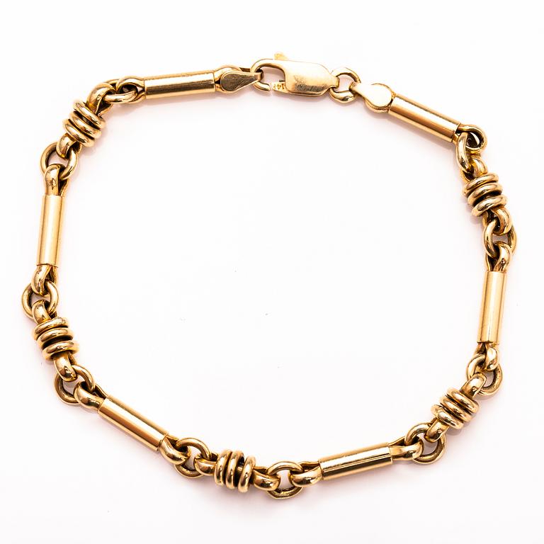 A 14K gold bracelet.