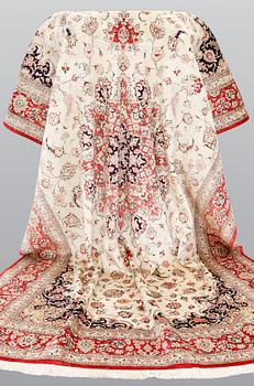 A silk Ghom carpet, 295 x 195 cm.