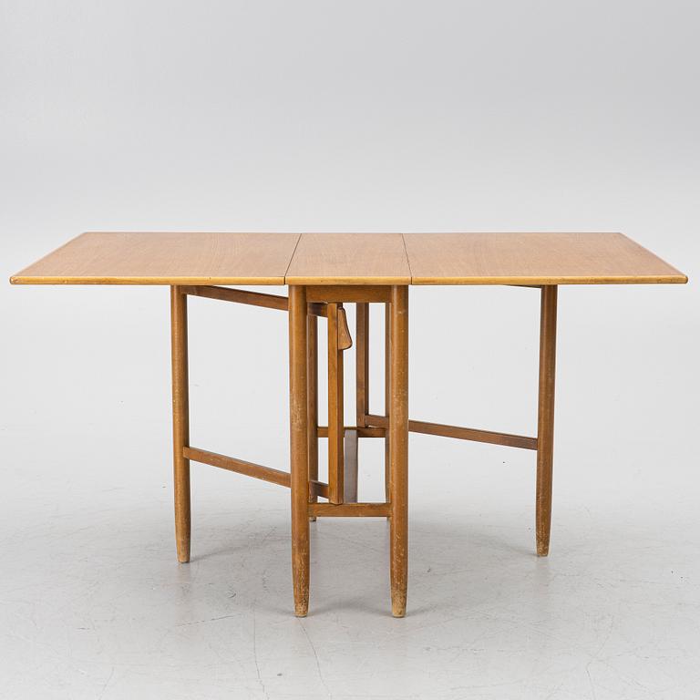 A mid20th century gate-leg table.
