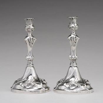 A pair of Swedish 18th century rococo silver candlesticks, mark of Jacob Lampa, Stockholm 1772.