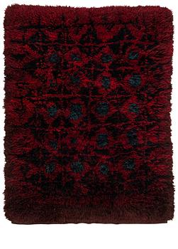 Kirsti Ilvessalo, a Finnish ryijy rug model for the Friends of Finnish Handicraft. Circa 166 x 118 cm.