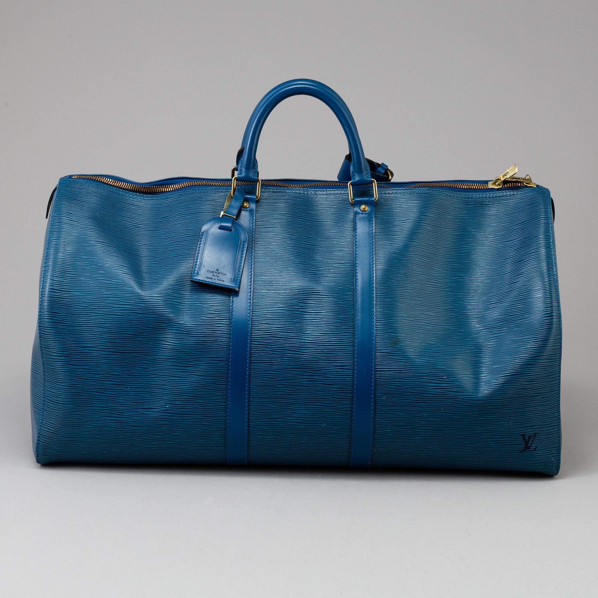 LOUIS VUITTON, a 'Keepall 55' epi leather weekend bag.