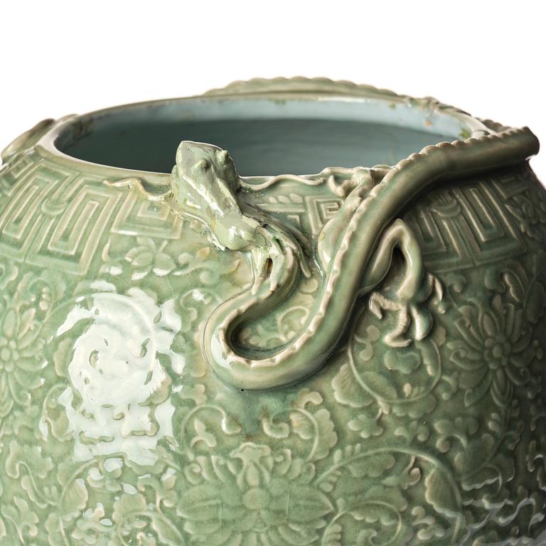 A large celadon 'lotus and qilong' vase, Qingdynasty, 19th century.