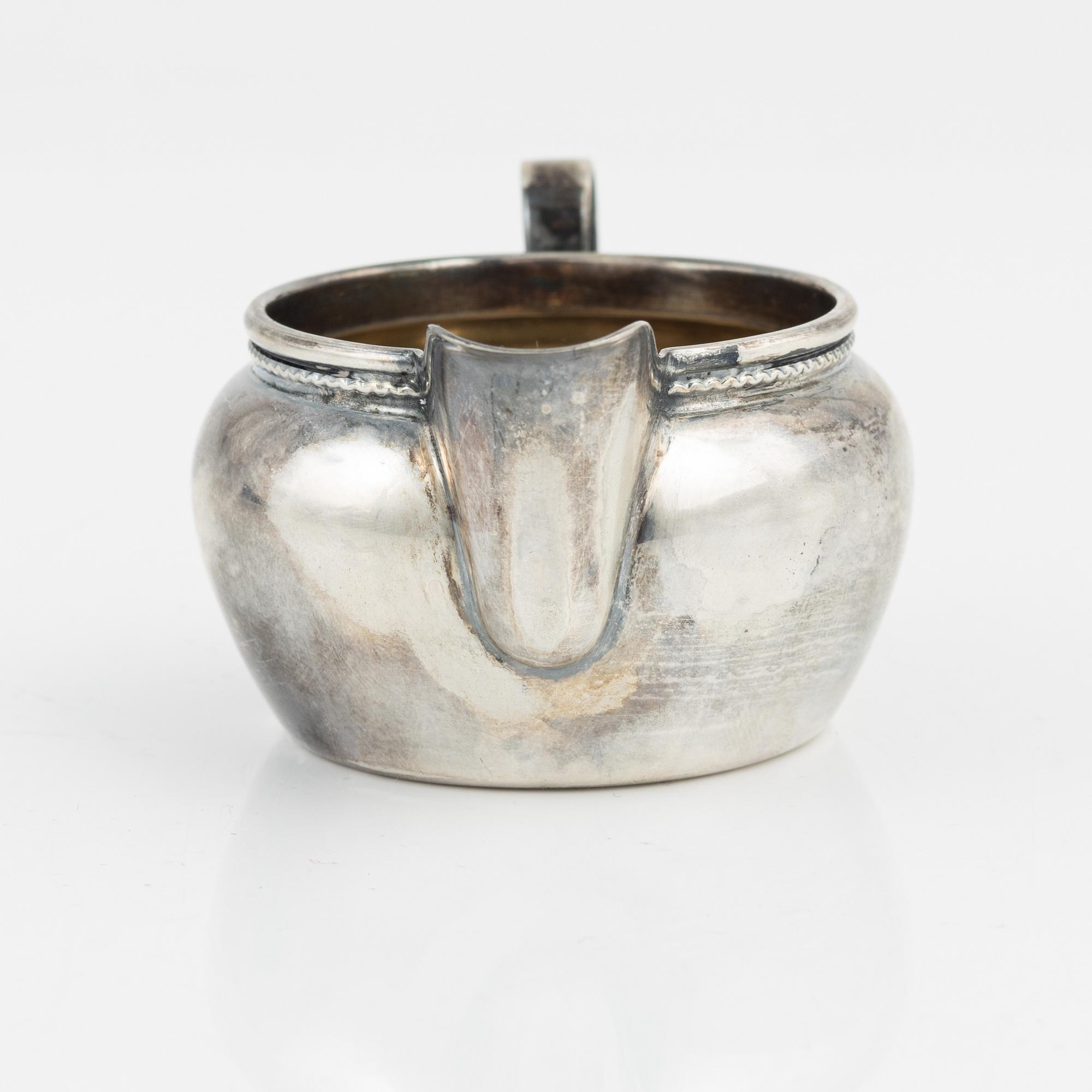 Three silver bowls and creamer, Sweden and Germany, 20th century.