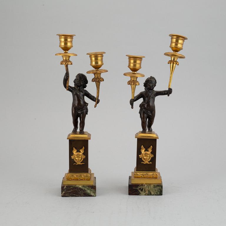 A pair of bronze empire style candleabra, 20th century.