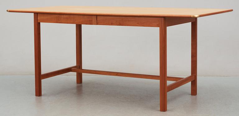 A Josef Frank ash and mahogany desk with brass fittings, by Svenskt Tenn.