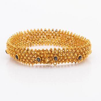 ARMBAND 14K guld, 35,1 g. bruna cabochonslipade stenar, ca 19 x 1,5 cm.