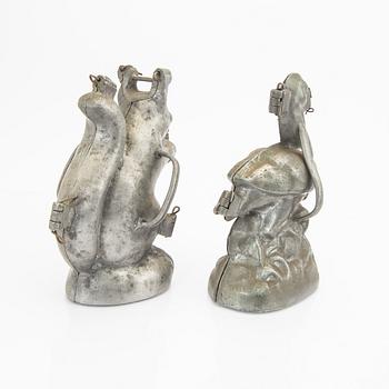 A set of four pewter icecream moulds around 1900.