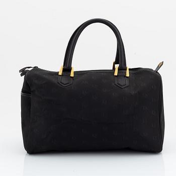 Christian Dior, a black canvas weekend bag.