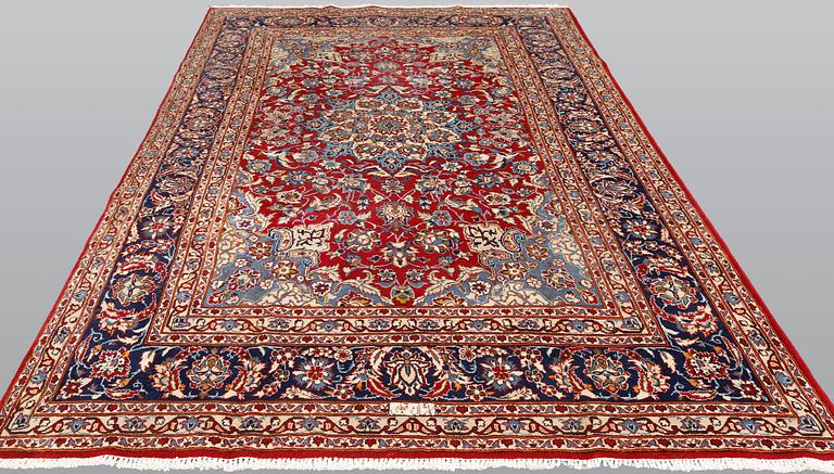 A signed Kashan carpet, ca 313 x 195 cm.