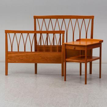 A Carl Malmsten head boards and bedside table, late 20th century.