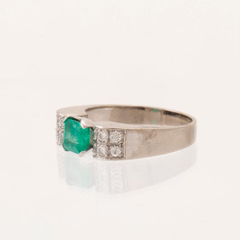 W.A. Bolin, ring 18K white gold with a rectangular step-cut emerald and round brilliant-cut diamonds, Stockholm 1976.