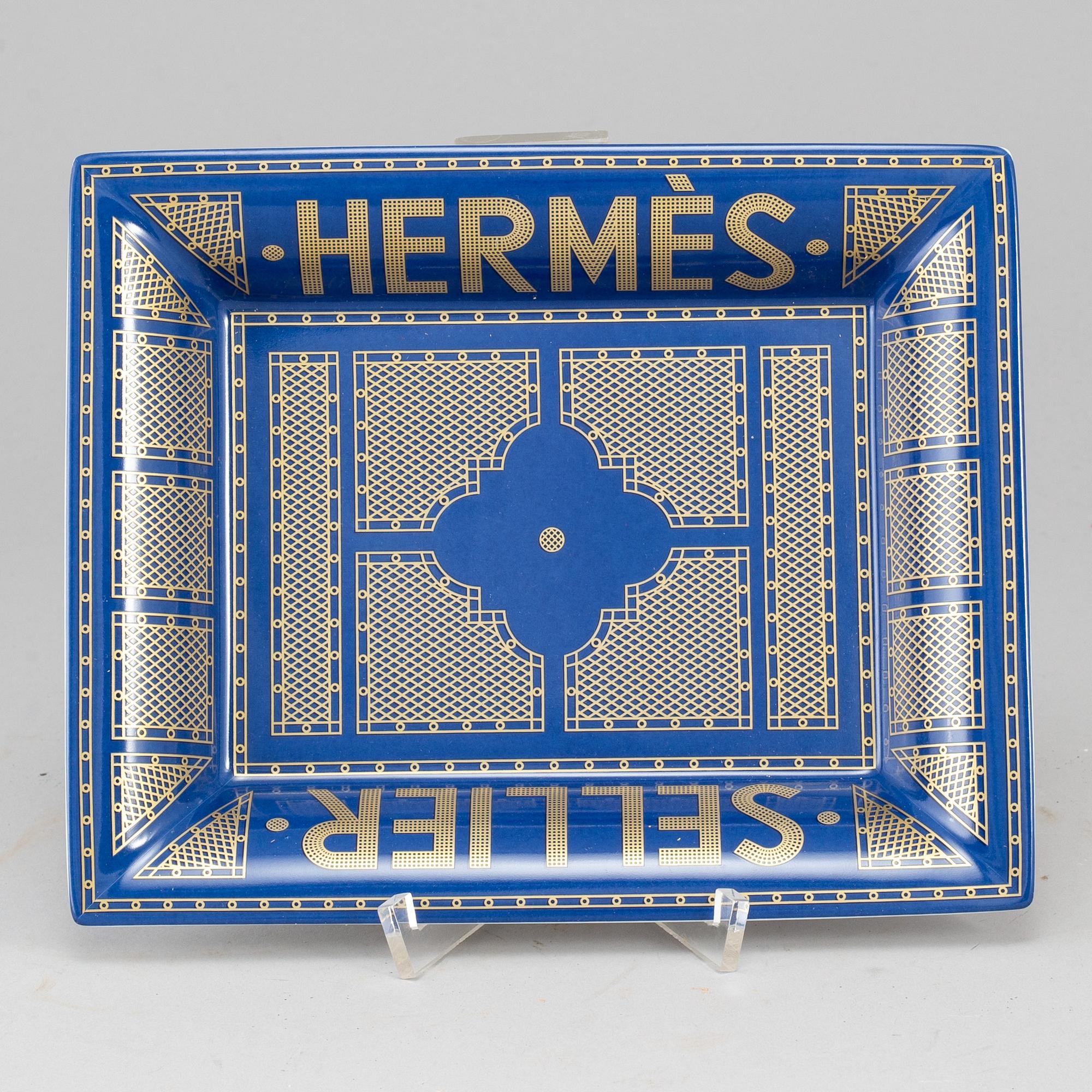 HERMÈS, a porcelain change tray.