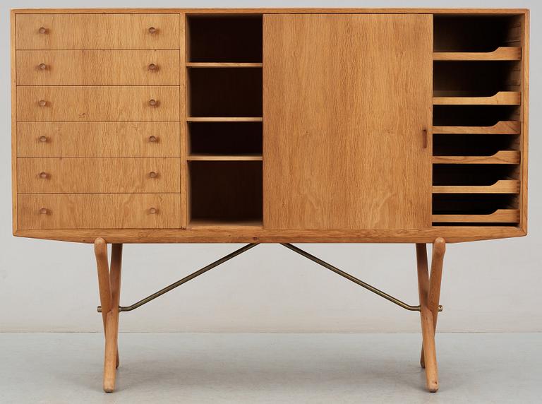 A Hans J Wegner oak cross-shaped leg sideboard by Andreas Tuck, Denmark.