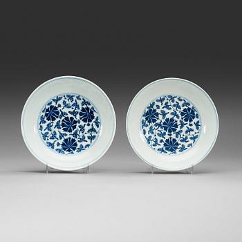 18. A pair of blue and white lotus dishes, Qing dynasty with Qianlong seal mark.