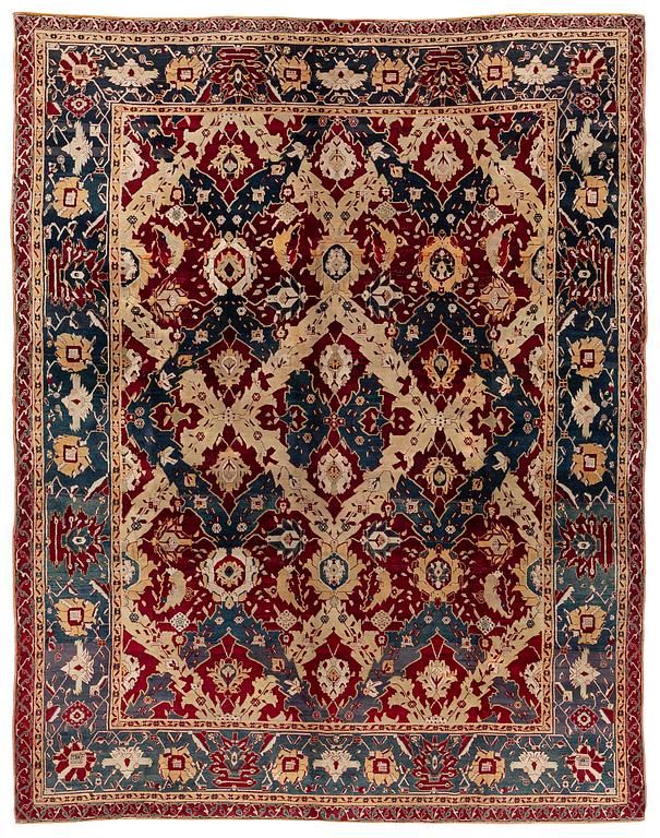An Antique Agra carpet of 'Dragon Lattice' design, North India, 375 x 298 cm.