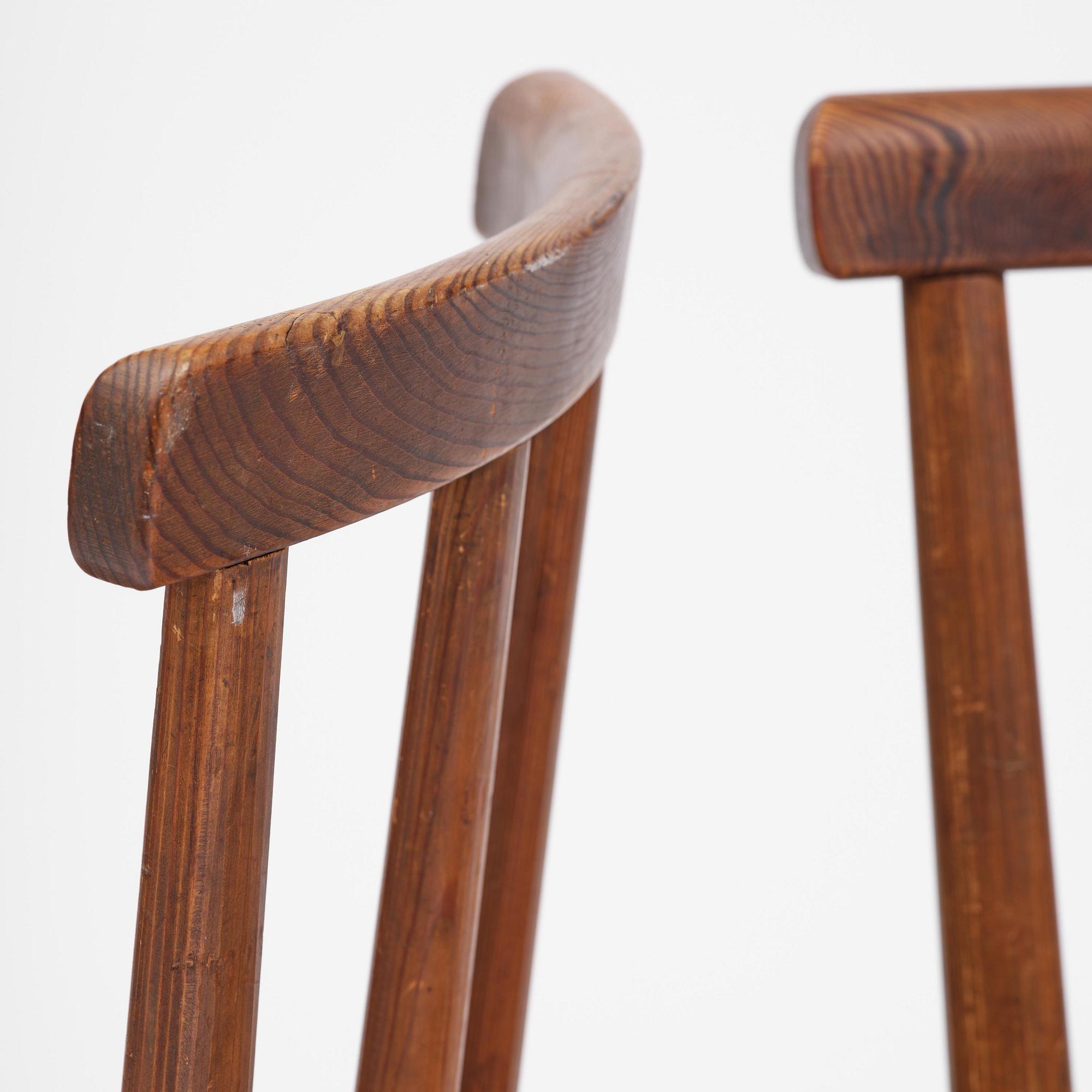 Axel Einar Hjorth, a set of four stained pine "Utö" chairs, Nordiska Kompaniet, Sweden, 1930s.
