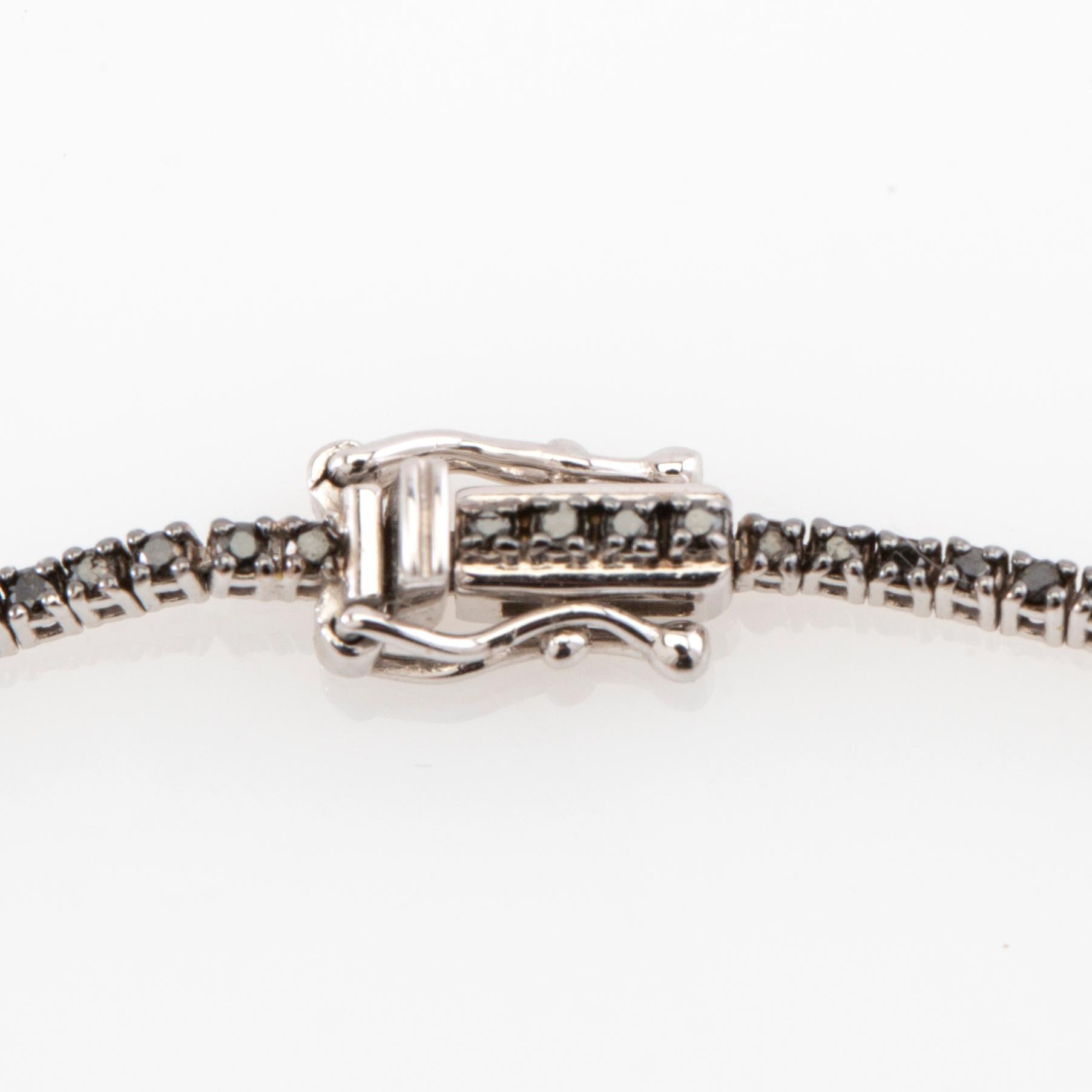 Tennis bracelet 18K white gold with black diamonds.