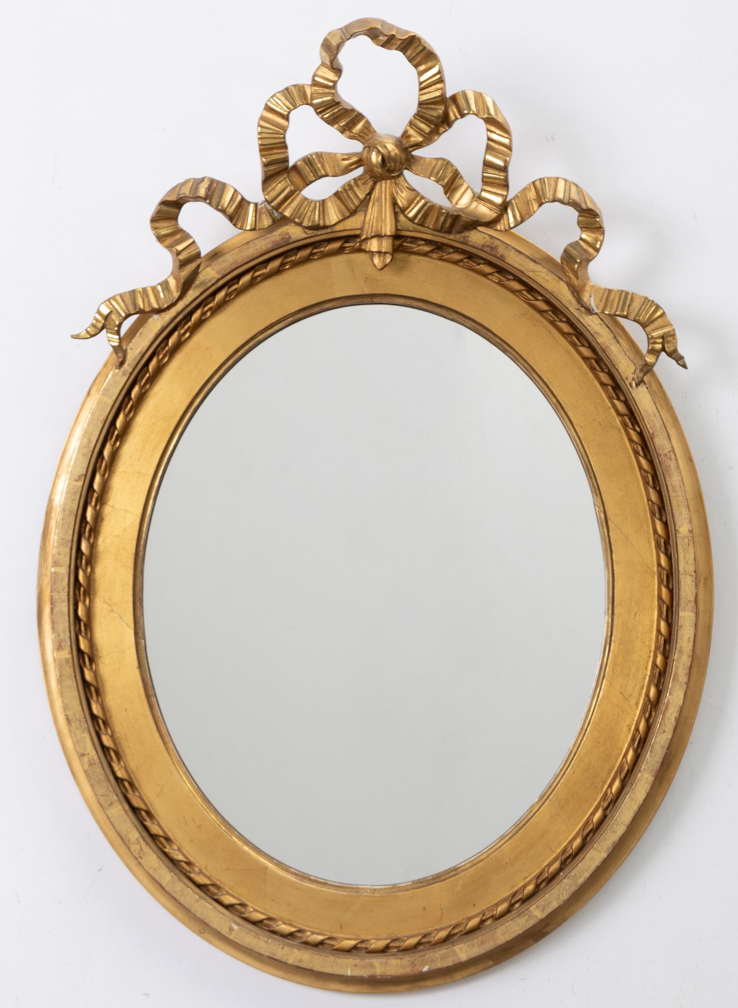 A Gustavian style mirror, early 20th Century.