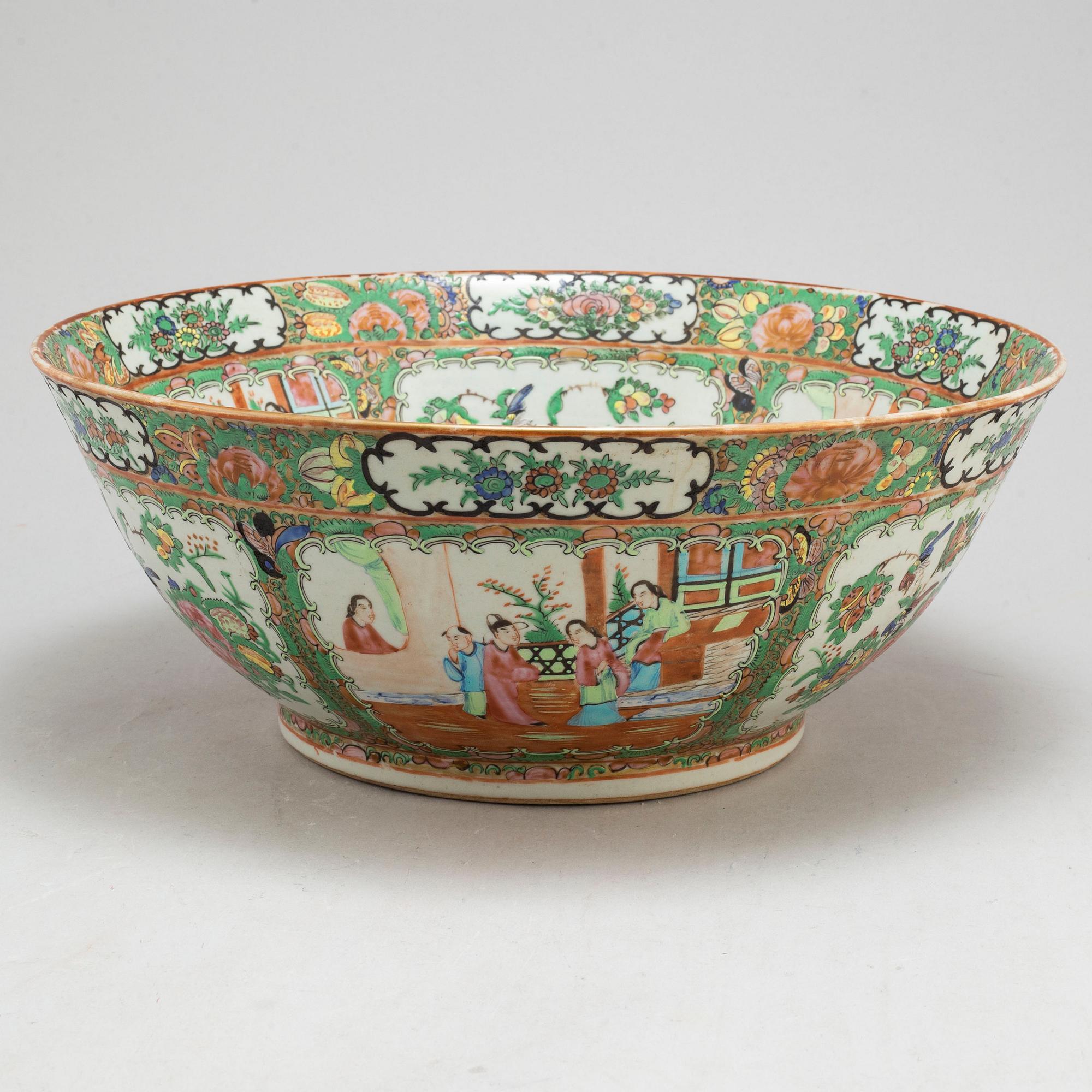 A famille rose 'Canton' punch bowl, Qing dynasty, late 19th century.