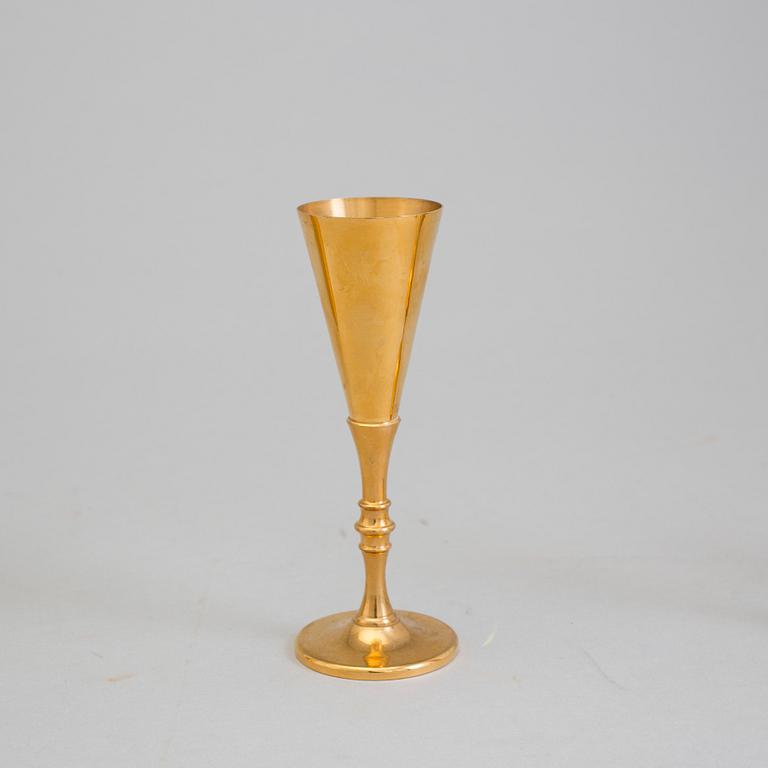 A gilt brass bottle and five glasses from Skultuna, 1989-96.
