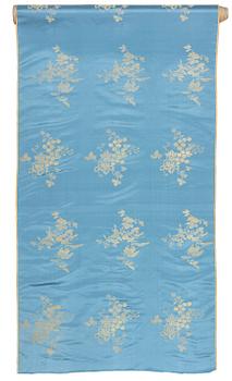 851. A bolt of Chinese pale blue and gold silk fabric, early 20th century.