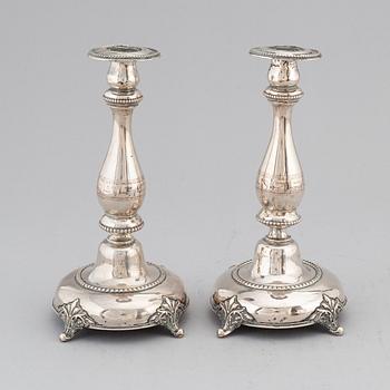 A pair of silver candlesticks, circa 1900.