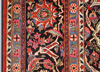 A semi-antique Keshan carpet, approx. 370 x 272 cm.