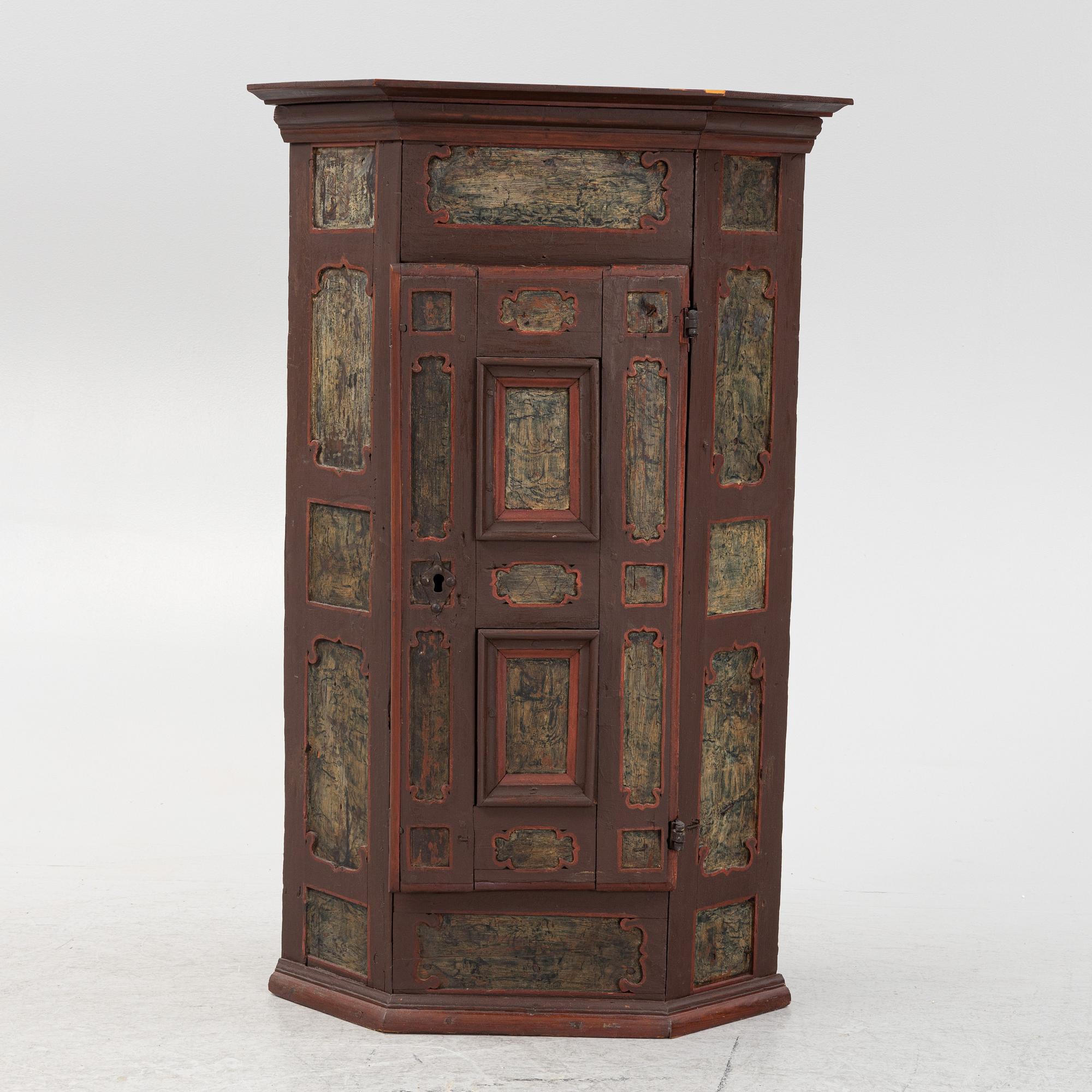 A corner cabinet, 18th Century.