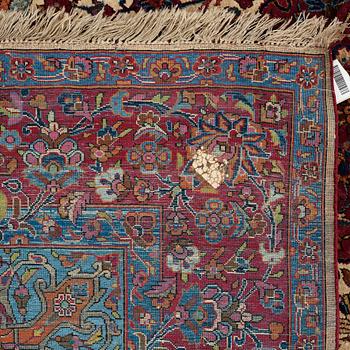 A CARPET, a semi-antique silk Kashan, ca 208,5 x 130 cm.