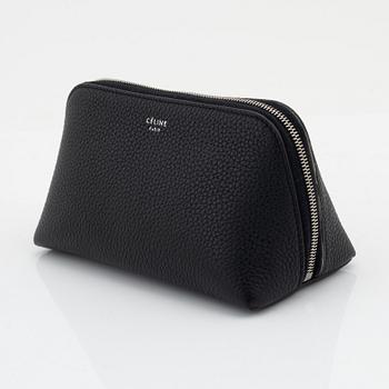 Céline, A small cosmetic pouch in black leather.