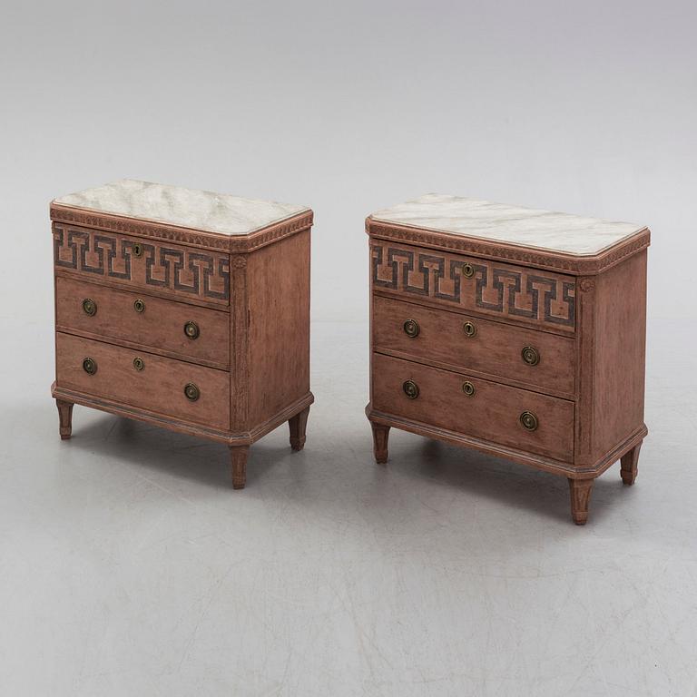 A pair of Gustavian style painted chest of drawers.