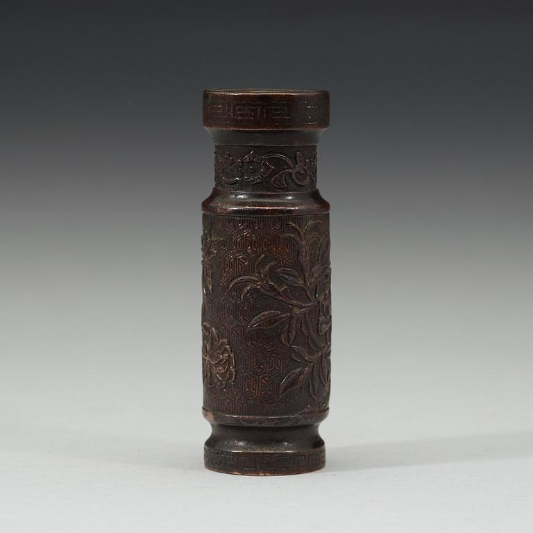 A cylindrical patinated bronze vase with silver inlay, Qing dynasty, 18th century.