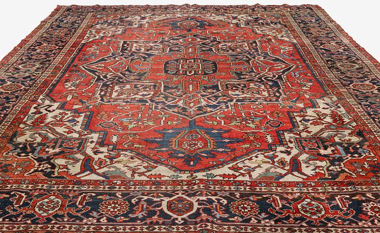 An antique Heris/Karadja carpet, approximately 501 x 339-353 cm.