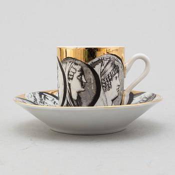 FORNASETTI, eight porcelian espresso cups and saucers from Milan, Italy.