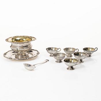 Gustaf Möllenborg, a silver bowl, Stockholm 1851, six silver punch cups, including CG Hallberg, and a silver spoon.