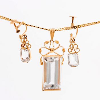 STIGBERT chainn and pendant and earrings, 18l gold and rock crystal.