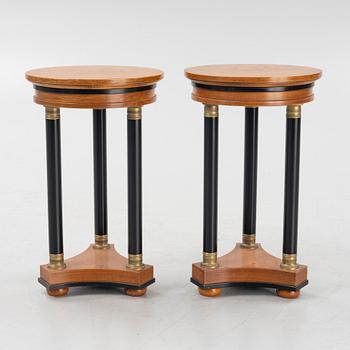 A pair of Empire-style side tables, later part of the 20th century.